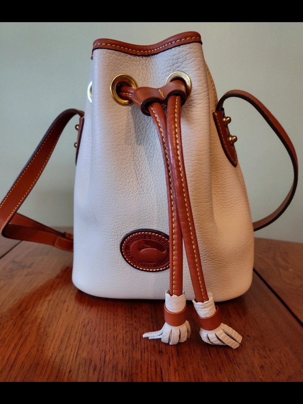 Dooney & Bourke White and Brown Leather Drawstring Bucket Bag